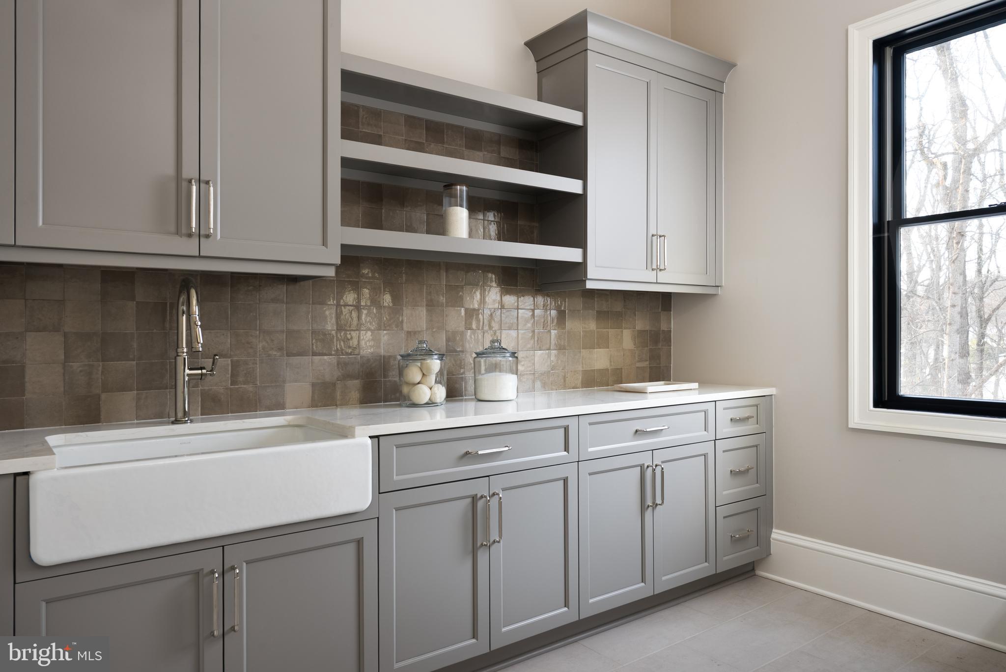 8634 Overlook Road McLean, VA 22102 - Photo 54 of 76 Upper-level laundry with Lobkovich cabinetry