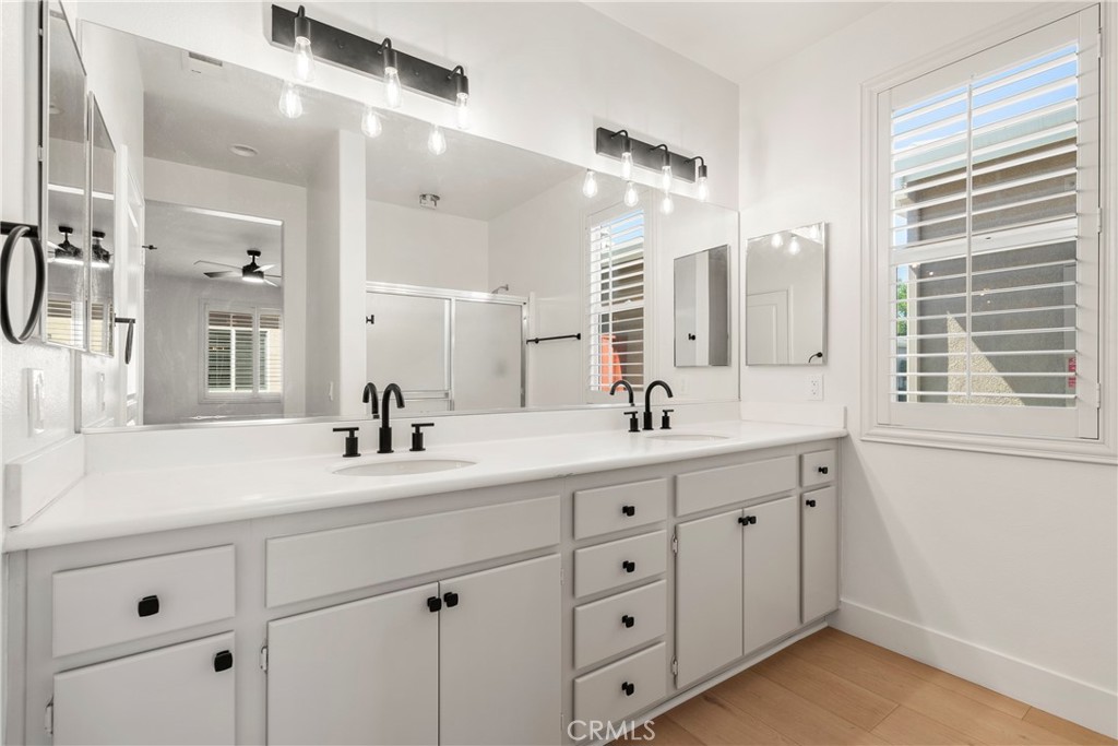 256 4 Seasons Boulevard Hemet, CA 92545 - Photo 12 of 31 a bathroom with a double vanity sink mirror and double