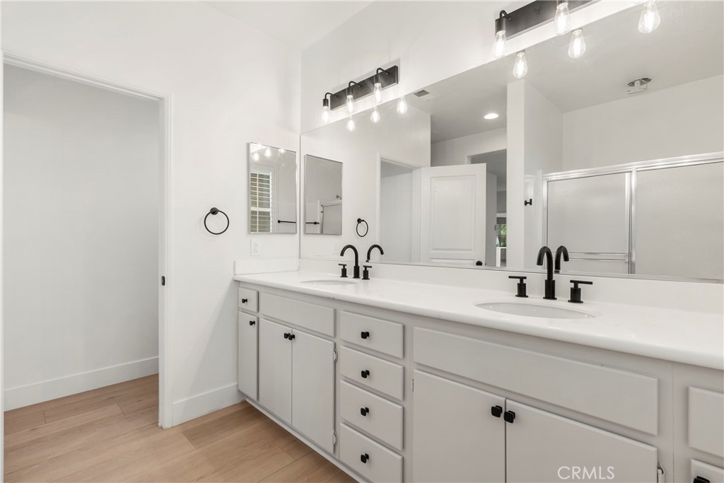 256 4 Seasons Boulevard Hemet, CA 92545 - Photo 13 of 31 a bathroom with a double vanity sink mirror and