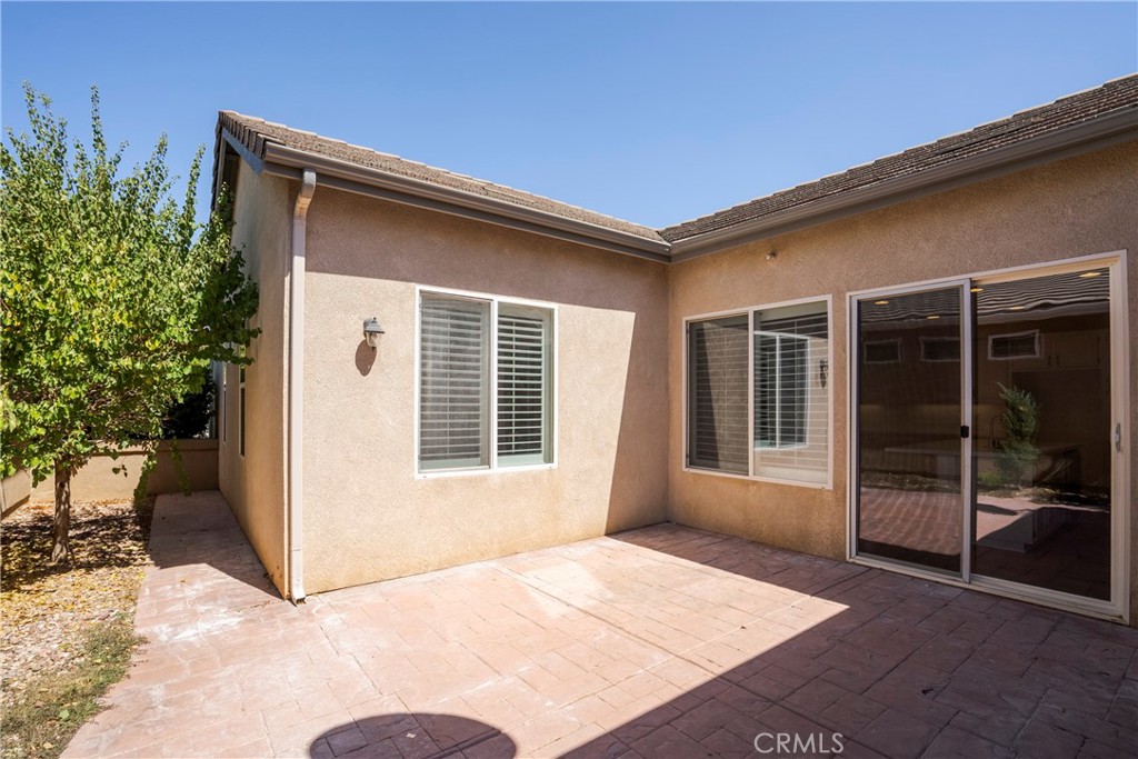 256 4 Seasons Boulevard Hemet, CA 92545 - Photo 20 of 31 a view of a house with a backyard