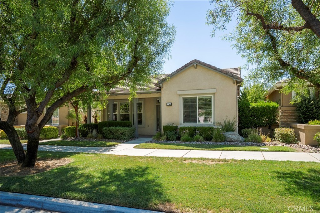 256 4 Seasons Boulevard Hemet, CA 92545 - Photo 2 of 31 a front view of a house with a yard
