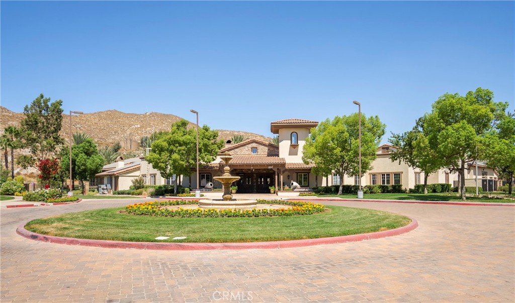 256 4 Seasons Boulevard Hemet, CA 92545 - Photo 25 of 31 a front view of a house with a yard