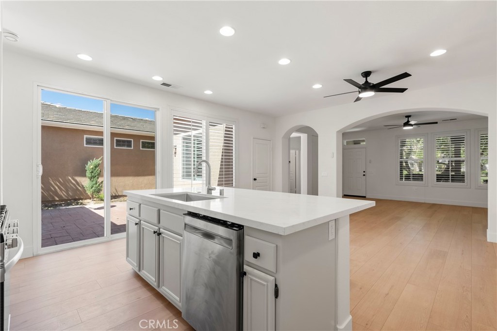 256 4 Seasons Boulevard Hemet, CA 92545 - Photo 8 of 31 a large white kitchen with a large window