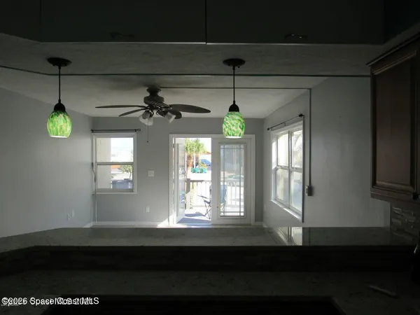 a kitchen with a sink a window and cabinets