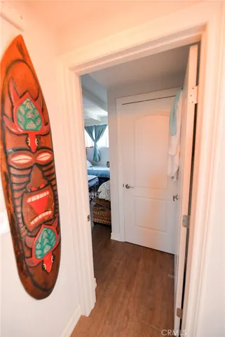 an entryway with wooden floor and a window