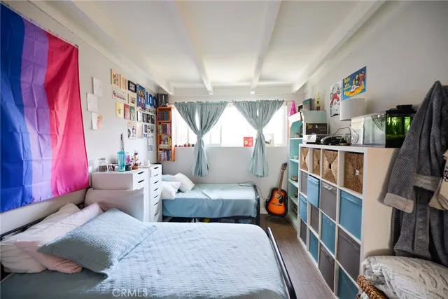 a bedroom with furniture and a window