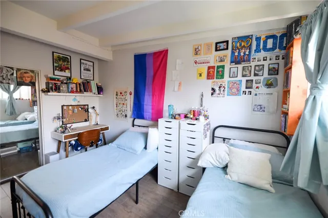 a living room with furniture toys and a book shelf