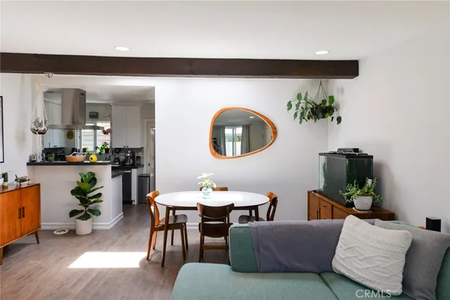 a living room with furniture and a mirror