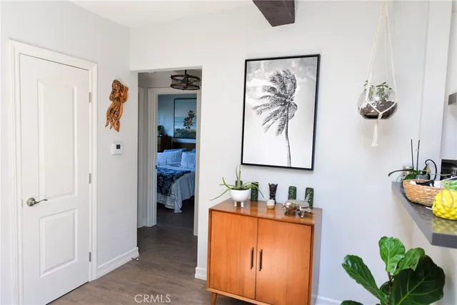 a room with furniture and painting on the wall