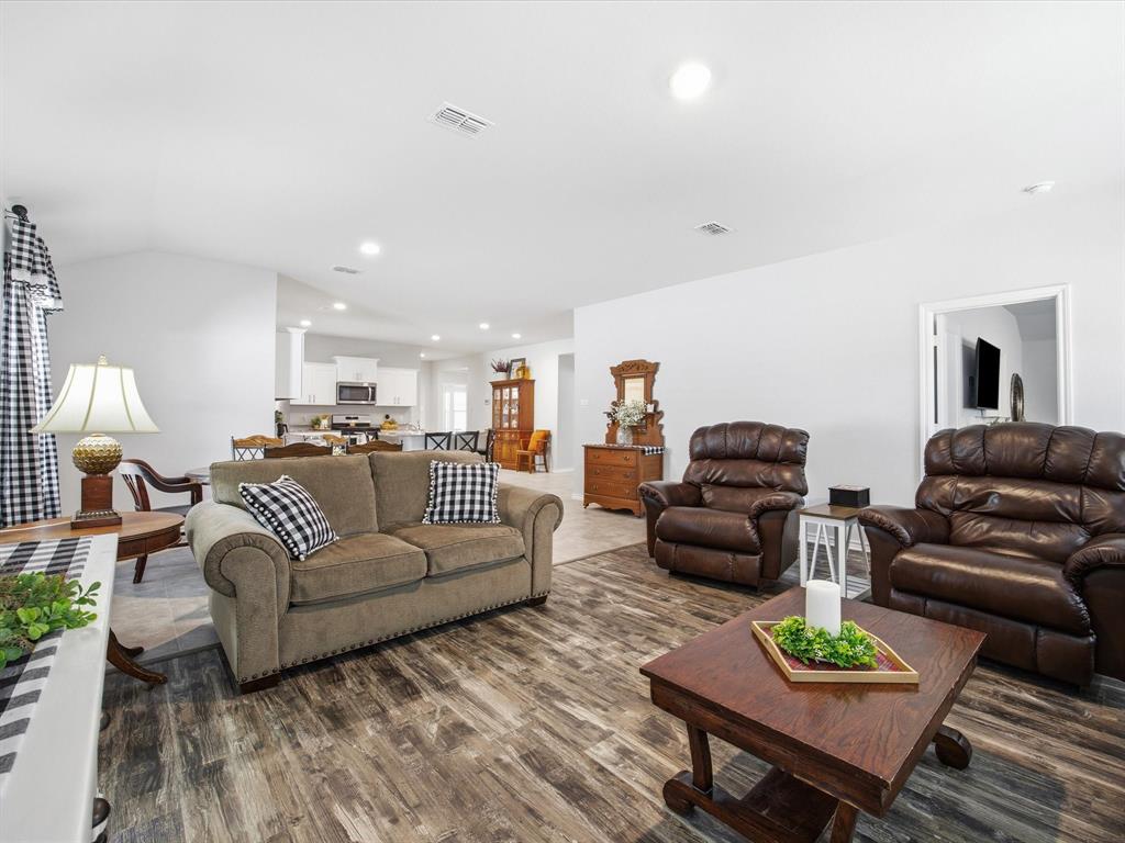 521 Bronze Circle East Springtown, TX 76082 - Photo 9 of 22 Living area right off the kitchen and dining