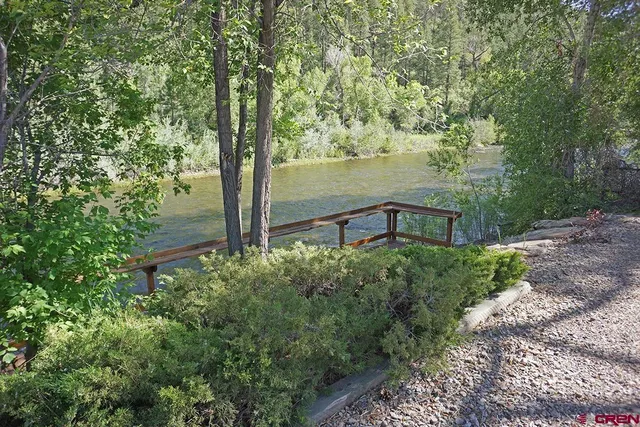 a view of a garden with a lake view