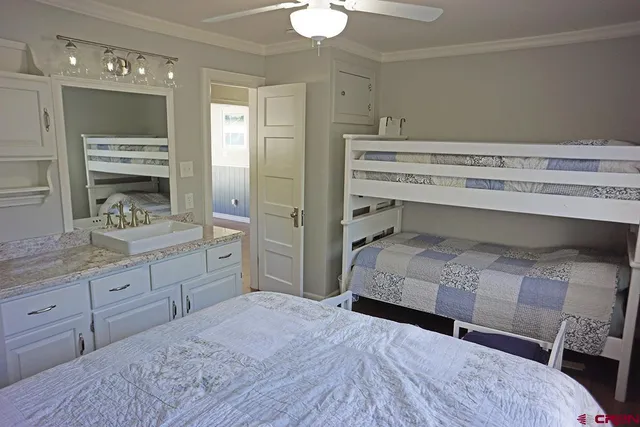a bedroom with a bed and a dresser