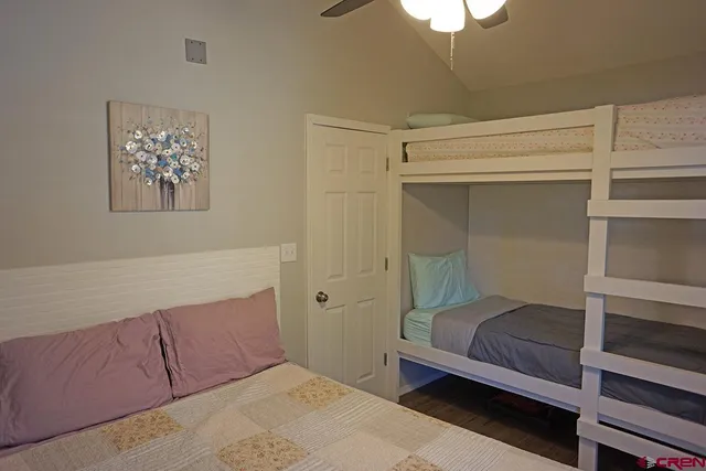 a porch with a table and chairs