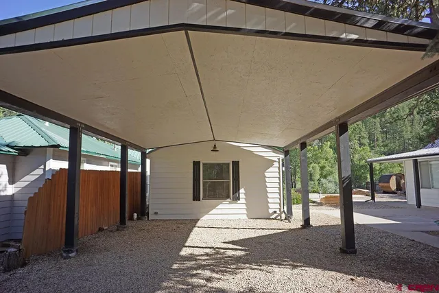a view of wooden floor with a bench