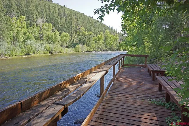 a view of wooden floor with a lake