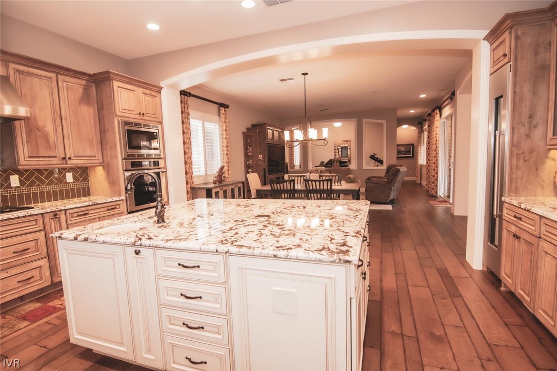 2265 Hyperion Lane Reno, NV 89521 - Photo 1 of 16 a view of a kitchen counter space a sink wooden floor and windows