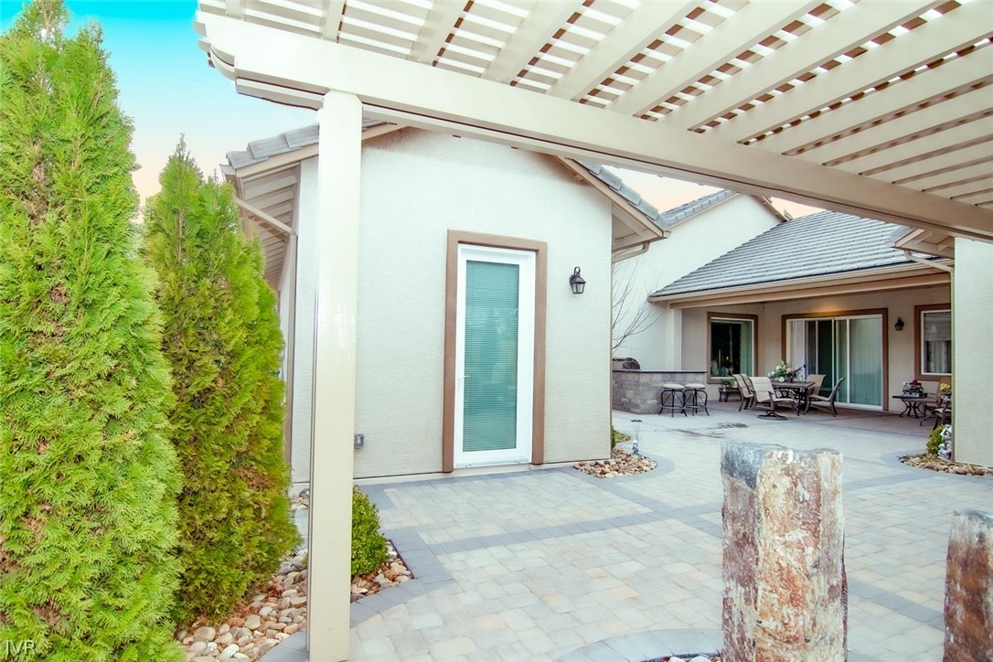 2265 Hyperion Lane Reno, NV 89521 - Photo 13 of 16 a view of a house with outdoor seating and a patio