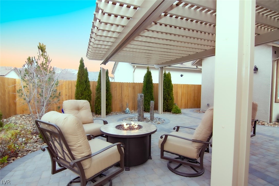 2265 Hyperion Lane Reno, NV 89521 - Photo 14 of 16 a view of a patio with couple of chairs and a dining table