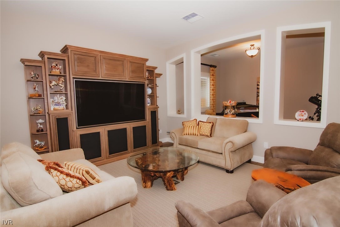 2265 Hyperion Lane Reno, NV 89521 - Photo 4 of 16 a living room with furniture and a flat screen tv