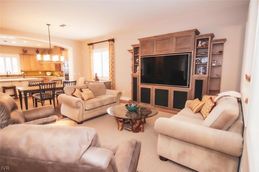 2265 Hyperion Lane Reno, NV 89521 - Photo 5 of 16 a living room with furniture and a flat screen tv