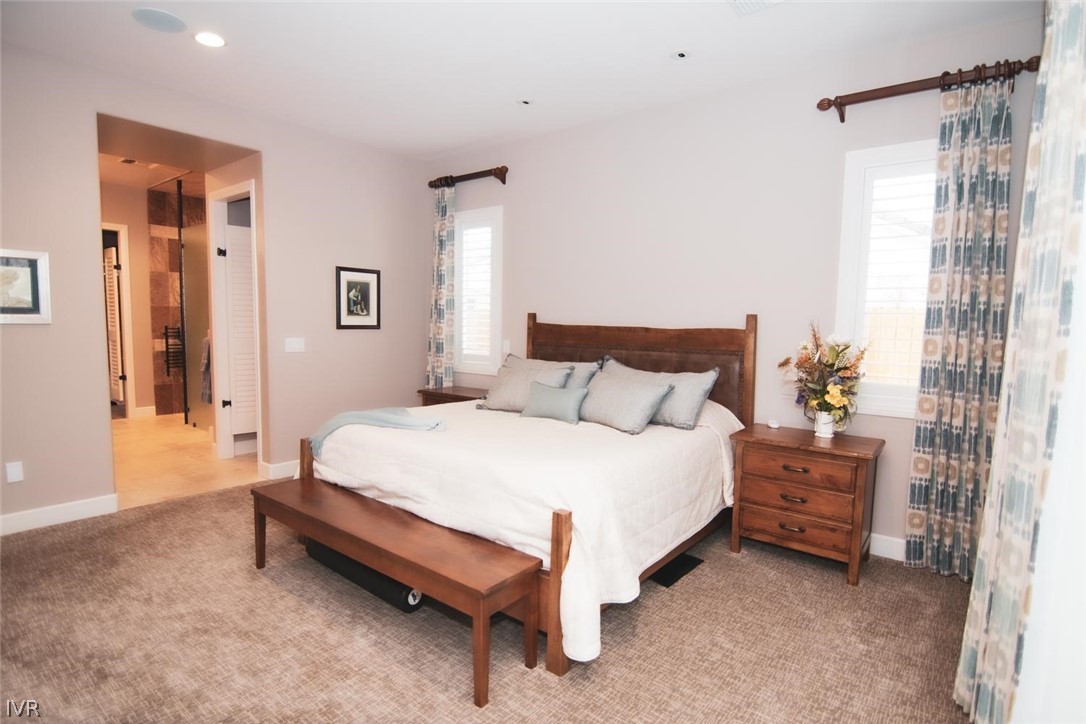 2265 Hyperion Lane Reno, NV 89521 - Photo 9 of 16 a spacious bedroom with a bed and a window
