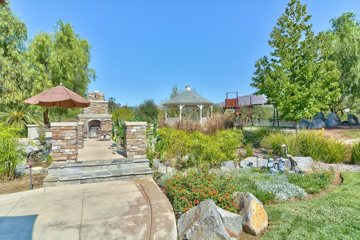 14009 Lake Poway Road Poway, CA 92064 - Photo 18 of 25 Stroll on the bridge over your private fish pond and explore all the areas beyond the pool!