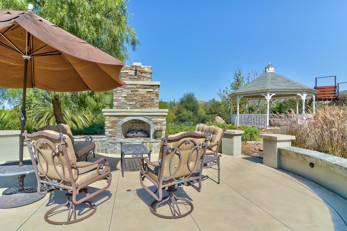 14009 Lake Poway Road Poway, CA 92064 - Photo 19 of 25 Talk with family or friends around the cozy outdoor fireplace!