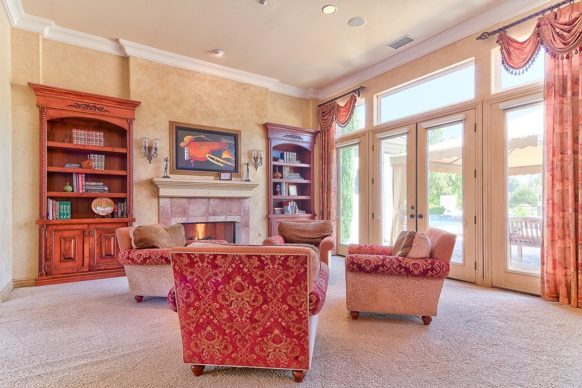 14009 Lake Poway Road Poway, CA 92064 - Photo 3 of 25 Warm and inviting with French doors leading outside! Even watch TV located behind the painting “built-in Via Design TV."