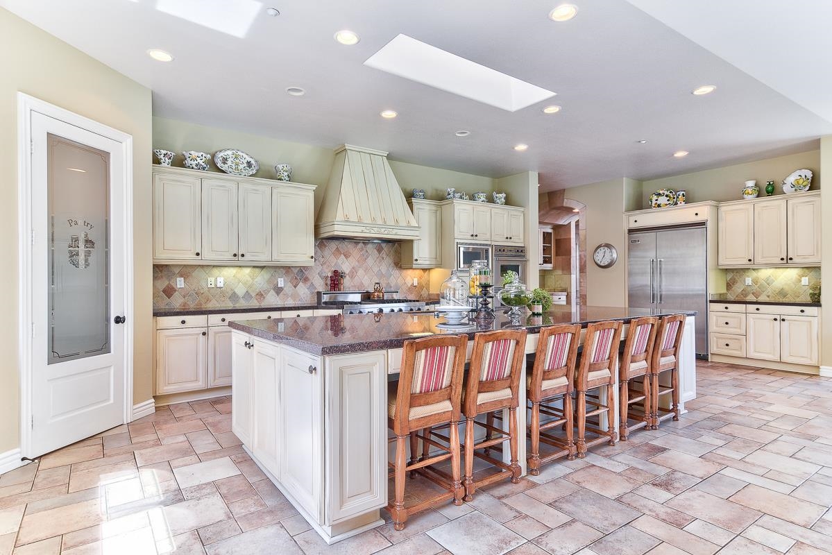 14009 Lake Poway Road Poway, CA 92064 - Photo 7 of 25 The gourmet kitchen boast a large pantry and island.