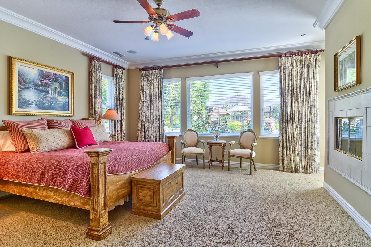 14009 Lake Poway Road Poway, CA 92064 - Photo 8 of 25 Warm and inviting master bedroom with fireplace and access to the rear yard oasis.