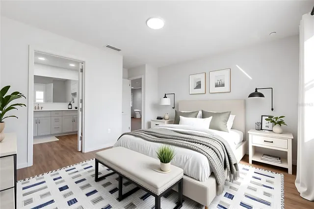 a bedroom with a bed and a couch