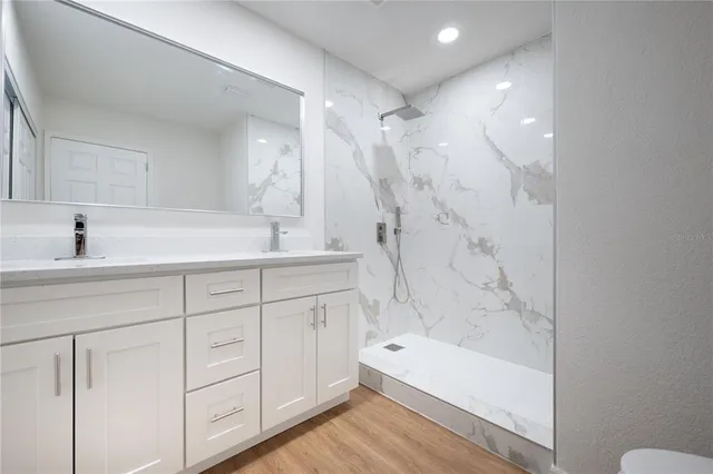 a bathroom with a tub sink and a mirror
