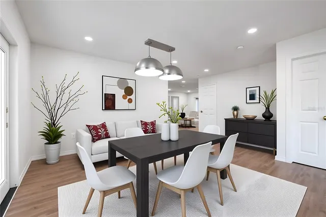 a view of a dining room with furniture and wooden floor