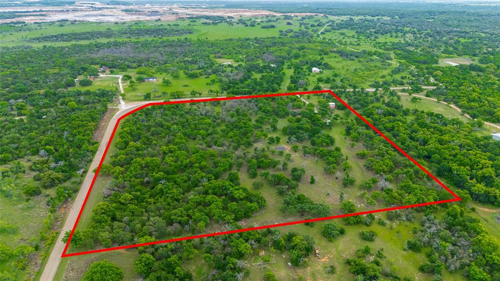 970 Live Oak Road Santo, TX 76472 - Photo 3 of 40 a yard with lots of green space and plants