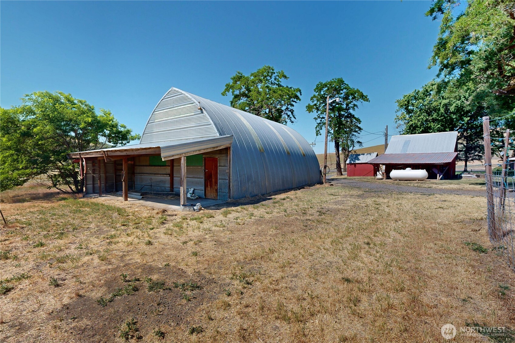 238 Patit Road Dayton, WA 99328 - Photo 11 of 40 a view of a house with a yard and potted plants