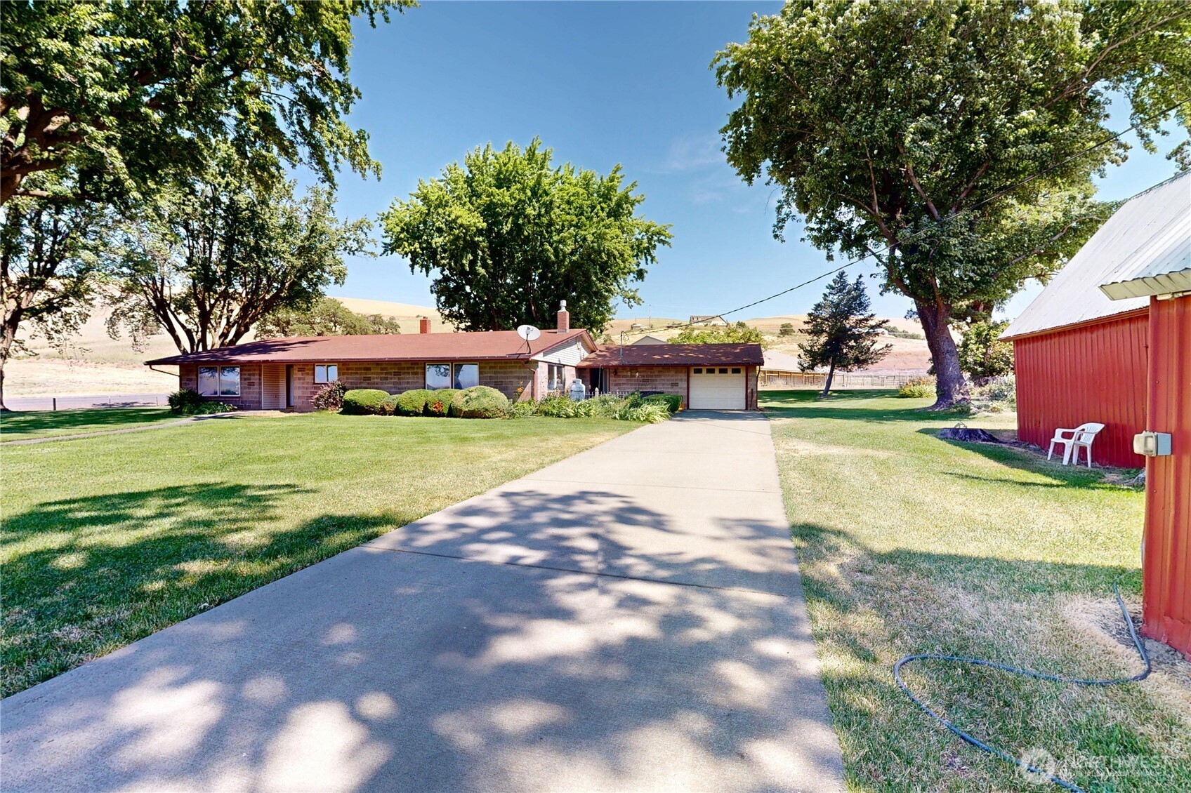 238 Patit Road Dayton, WA 99328 - Photo 2 of 40 a view of yard with swimming pool and green space