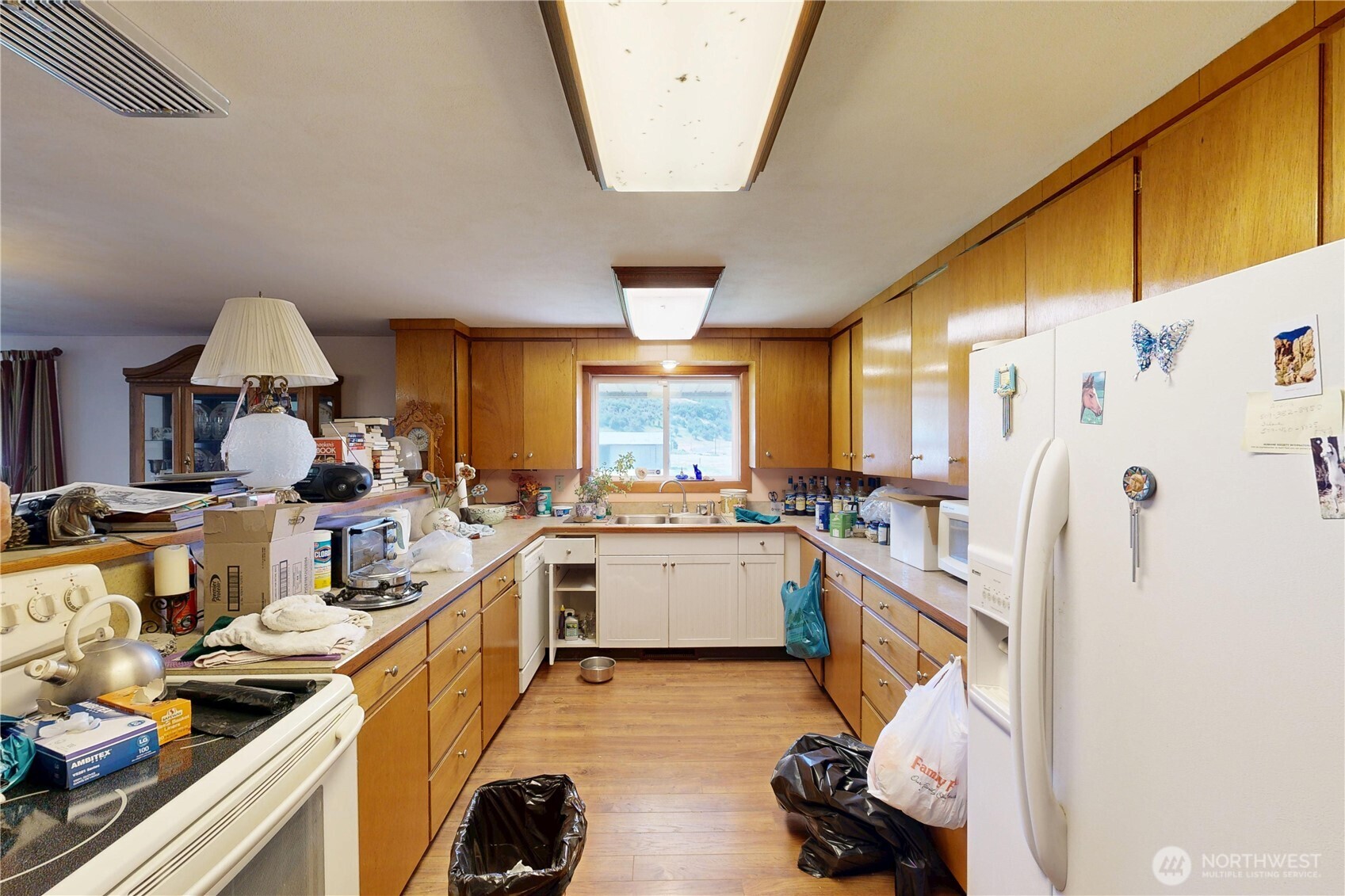 238 Patit Road Dayton, WA 99328 - Photo 36 of 40 a kitchen with a sink appliances and cabinets