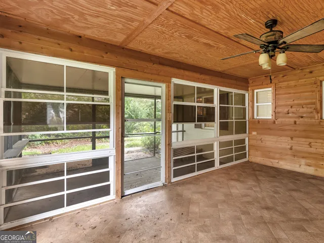 a view of an empty room with a balcony