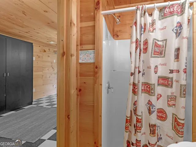 a bathroom with a shower and a sink