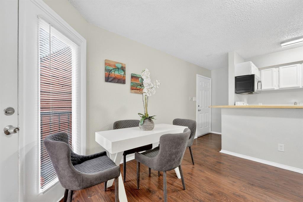 9825 Walnut Street, Unit 306 Dallas, TX 75243 - Photo 13 of 23 a view of a dining room with furniture and wooden floor