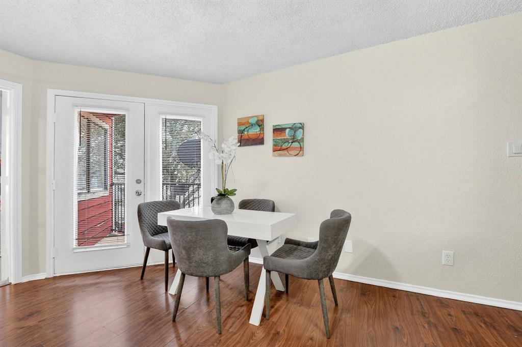 9825 Walnut Street, Unit 306 Dallas, TX 75243 - Photo 15 of 23 a view of a dining room with furniture and wooden floor