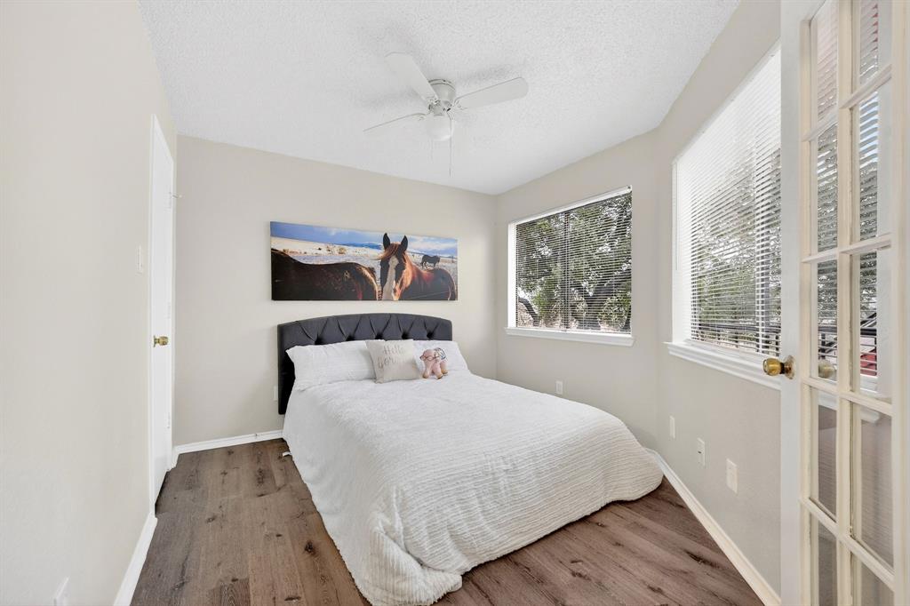 9825 Walnut Street, Unit 306 Dallas, TX 75243 - Photo 17 of 23 a bedroom with a large bed and a window