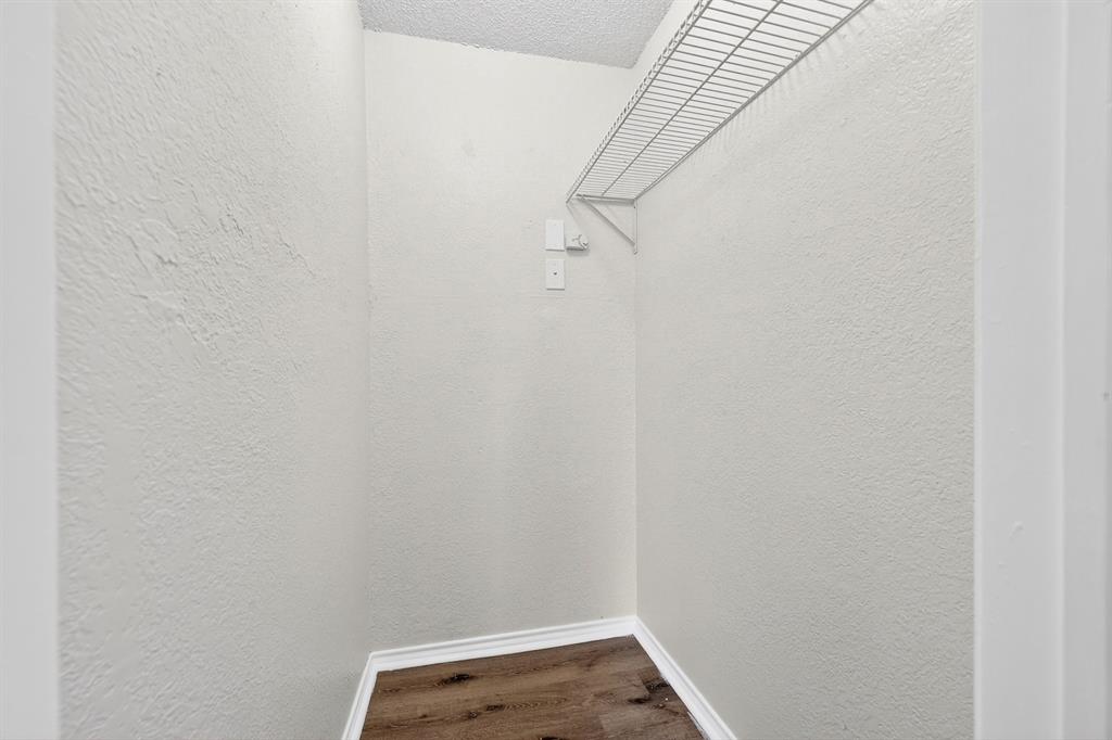 9825 Walnut Street, Unit 306 Dallas, TX 75243 - Photo 19 of 23 a view of small space with racks on the wall