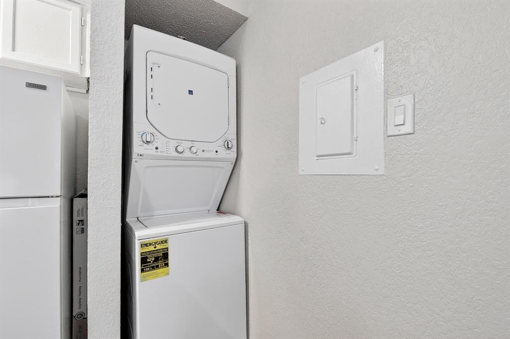 9825 Walnut Street, Unit 306 Dallas, TX 75243 - Photo 7 of 23 a utility room with dryer and washer