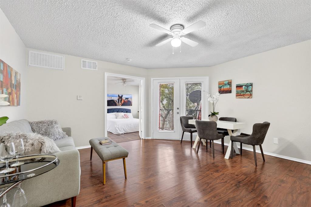 9825 Walnut Street, Unit 306 Dallas, TX 75243 - Photo 8 of 23 a view of a dining room with furniture and wooden floor