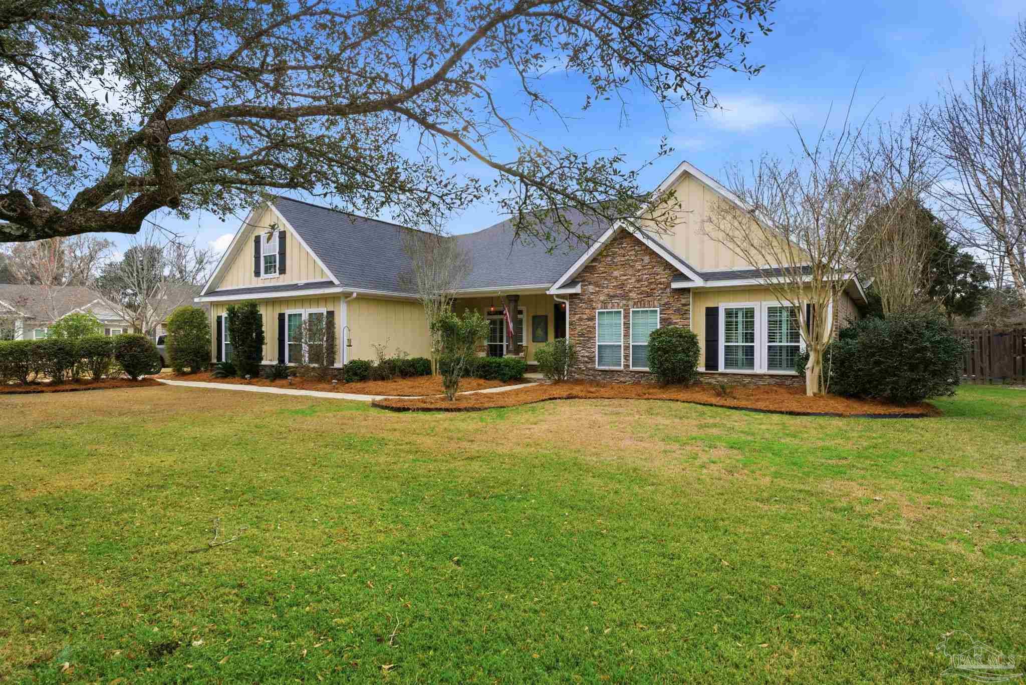 a front view of house with yard and seating area