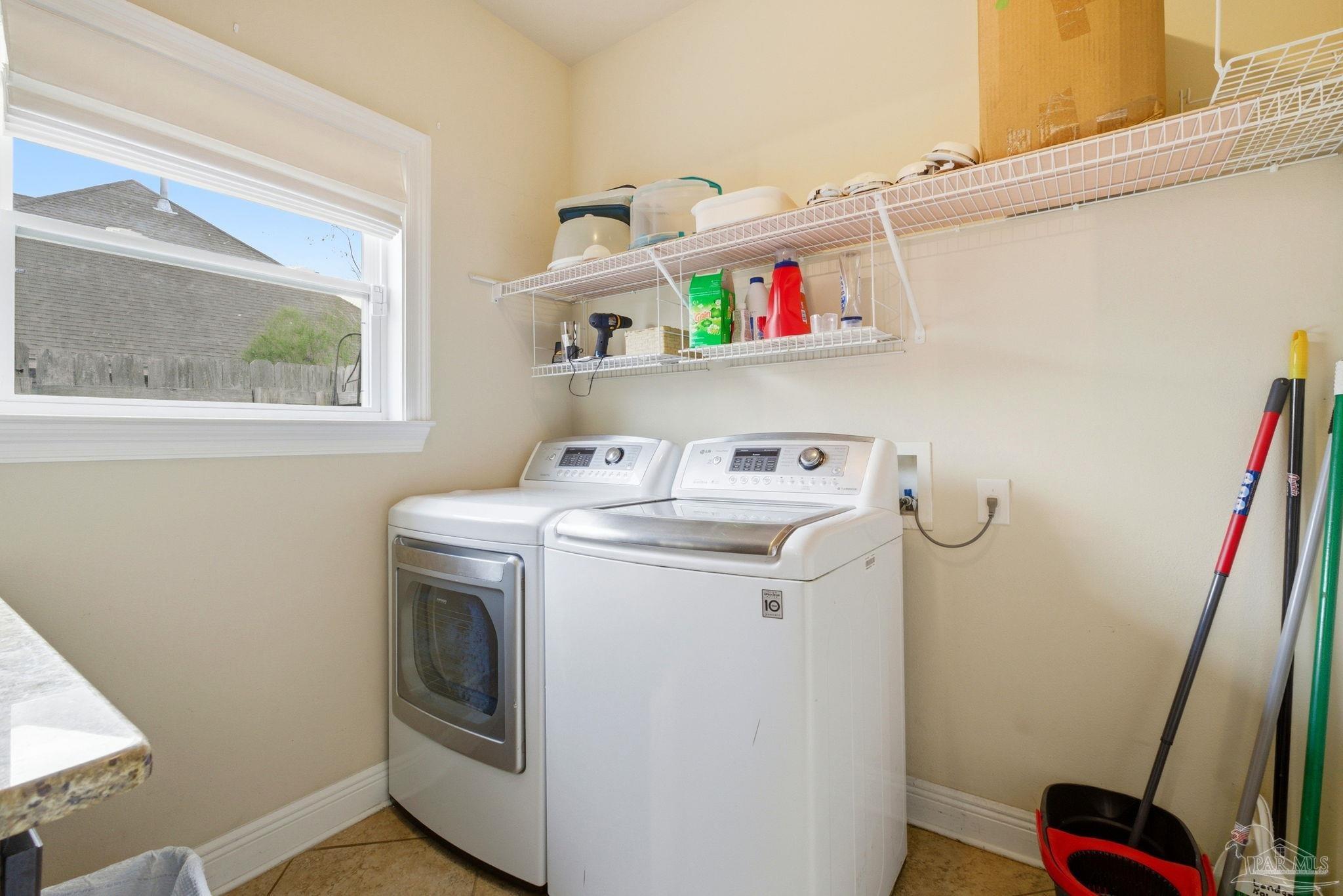 1207 Wings Way Cantonment, FL 32533 - Photo 17 of 39 a utility room with dryer and washer