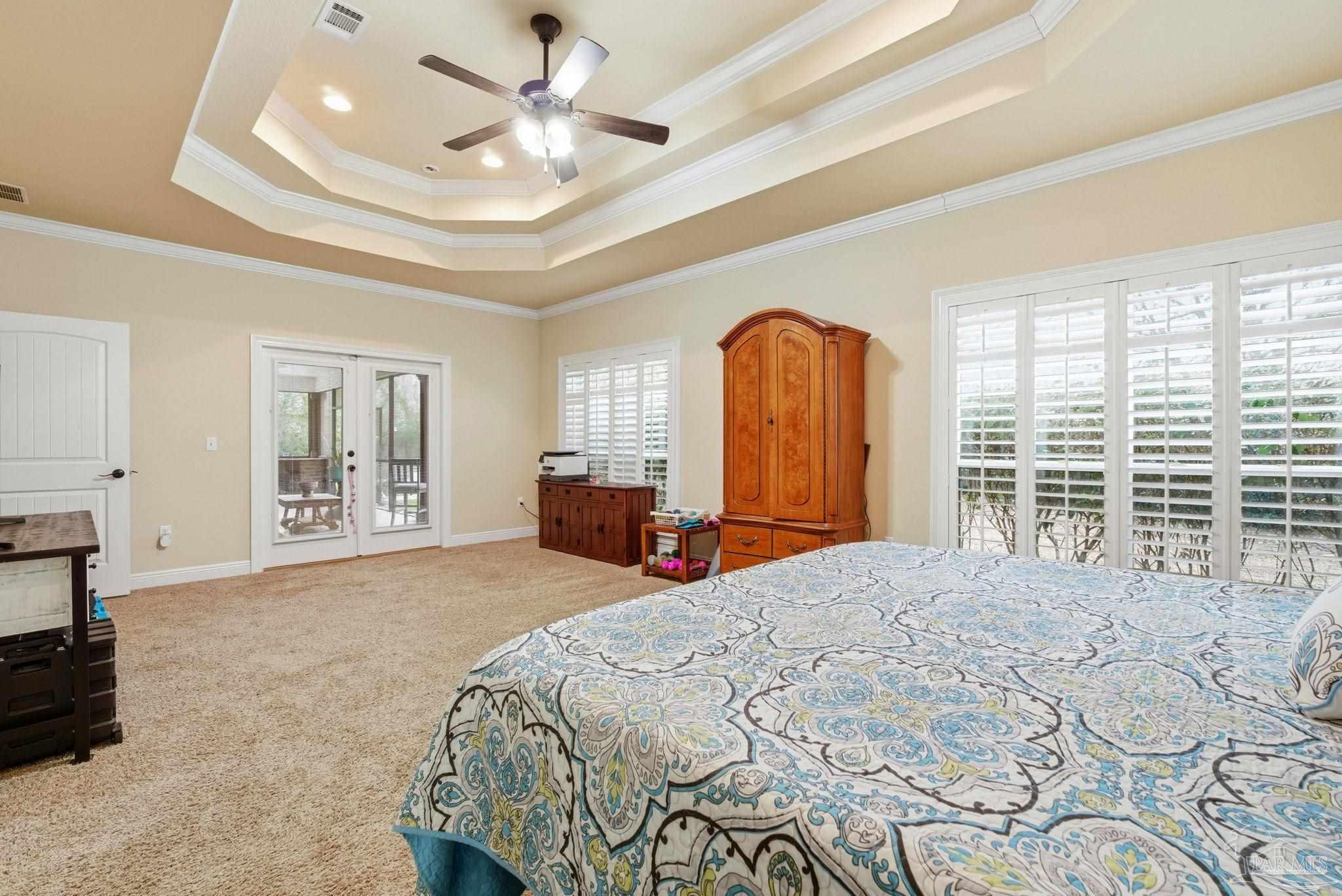 1207 Wings Way Cantonment, FL 32533 - Photo 19 of 39 a bed room with a bed and a large window