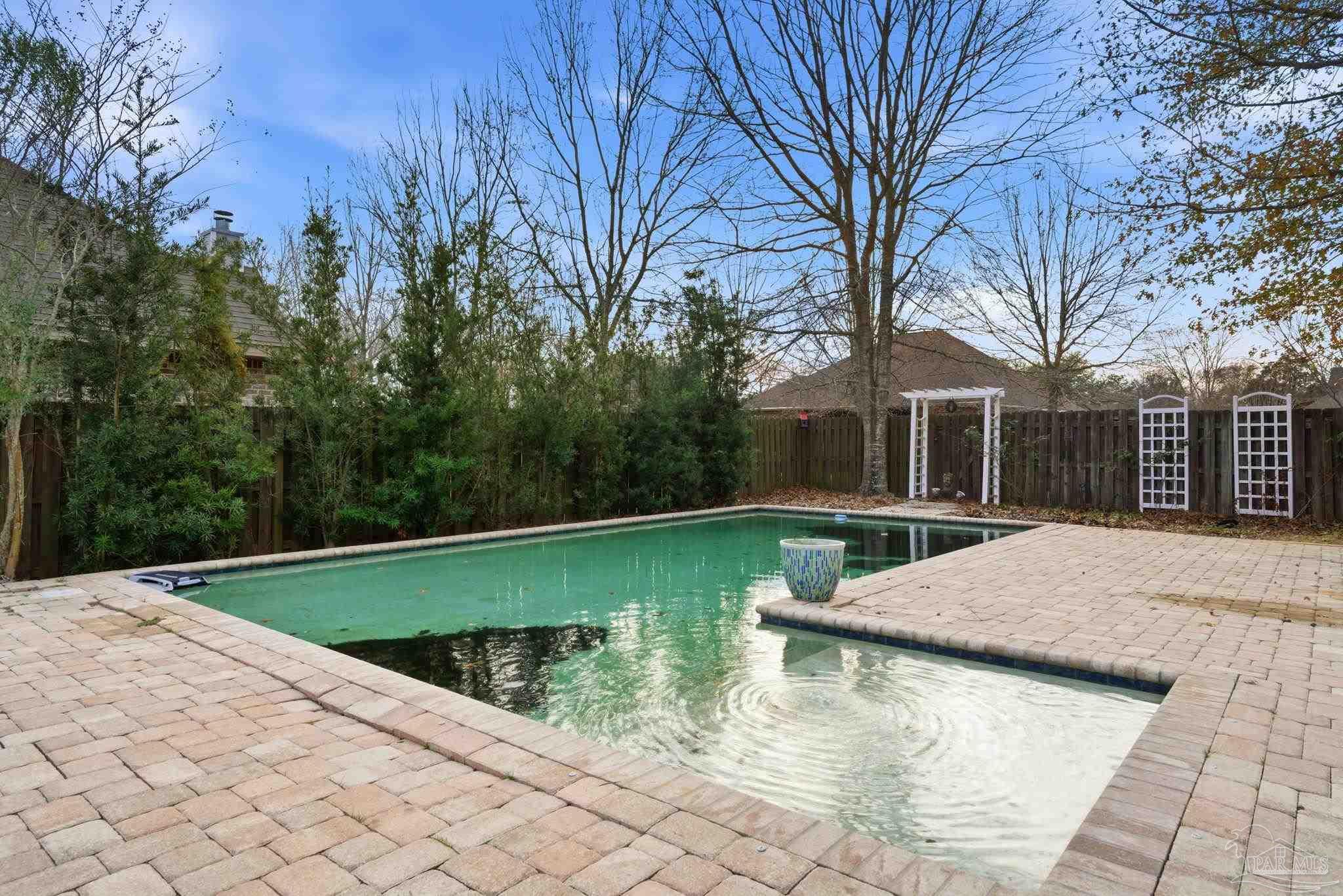 1207 Wings Way Cantonment, FL 32533 - Photo 2 of 39 a view of swimming pool with a patio
