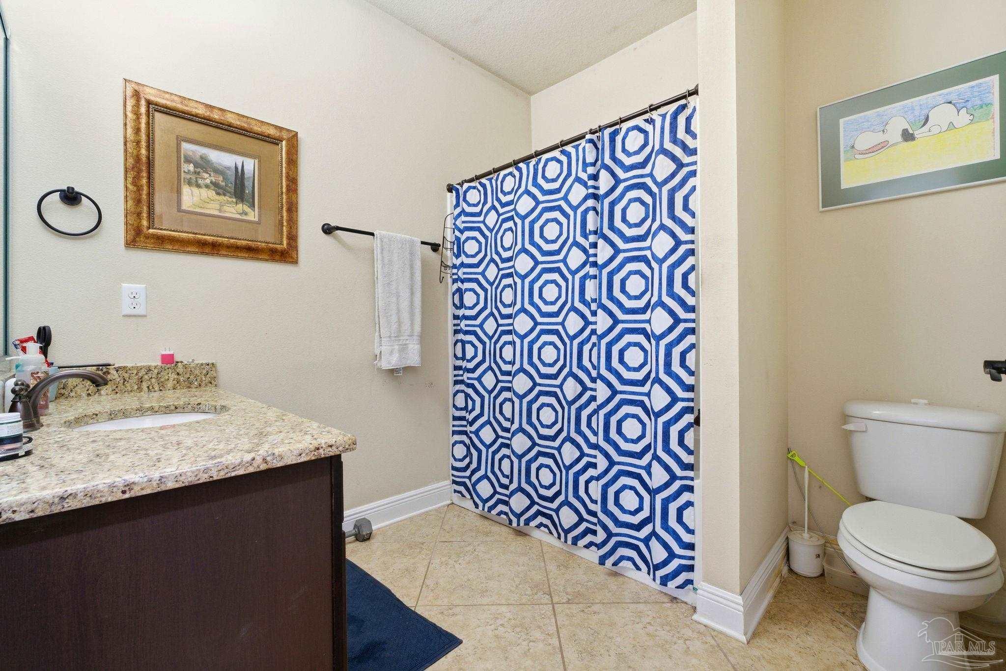 1207 Wings Way Cantonment, FL 32533 - Photo 25 of 39 a bathroom with a sink and a toilet